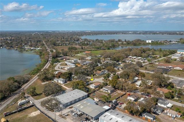 drone / aerial view with a residential view and a water view