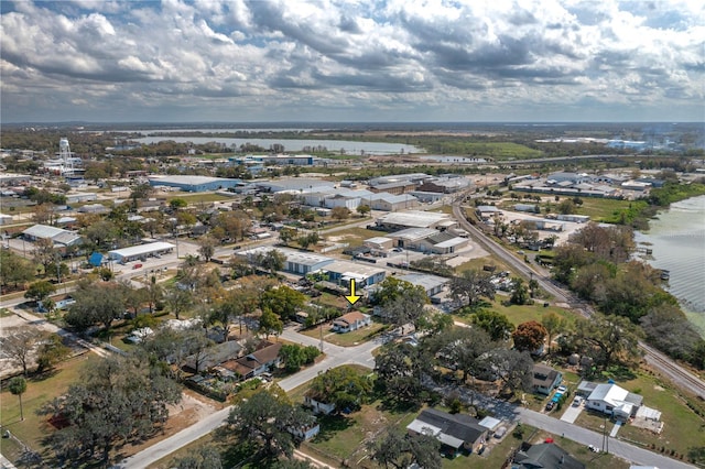 drone / aerial view with a water view and a residential view