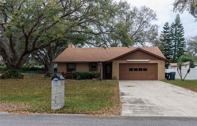 single story home featuring driveway, fence, a chimney, a front lawn, and a garage