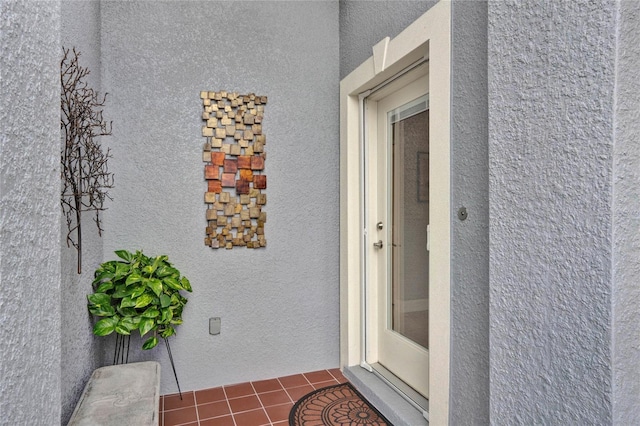 property entrance featuring stucco siding