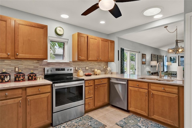 kitchen featuring a sink, stainless steel appliances, and light countertops