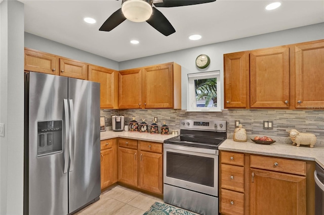 kitchen with appliances with stainless steel finishes, recessed lighting, backsplash, and a ceiling fan