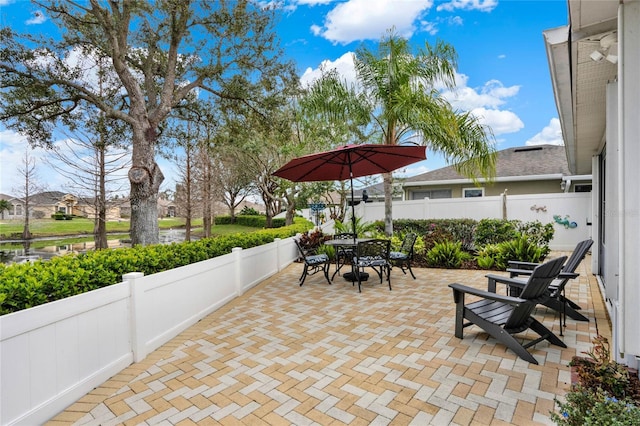 view of patio featuring a fenced backyard and outdoor dining space