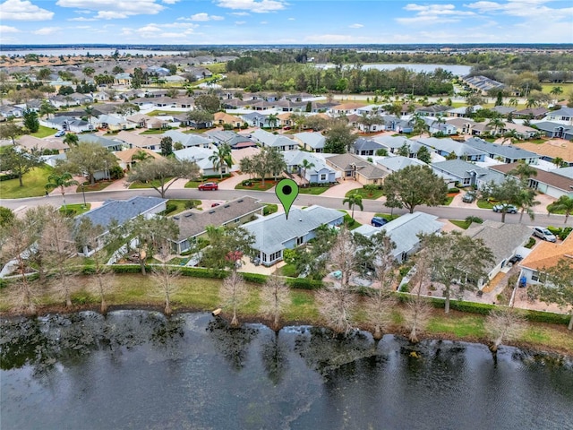 birds eye view of property with a residential view and a water view