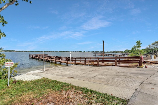 dock area with a water view