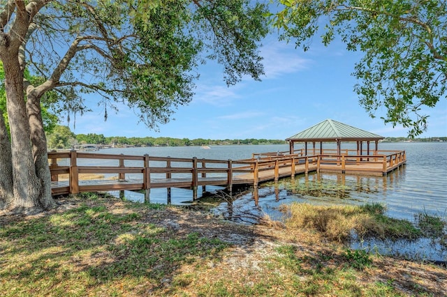 view of dock with a water view and a gazebo