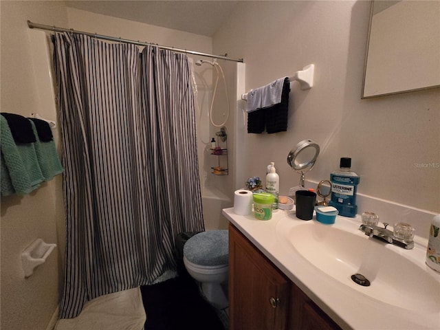 bathroom featuring shower / bath combination with curtain, vanity, and toilet