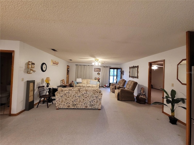 living room featuring a textured ceiling and visible vents