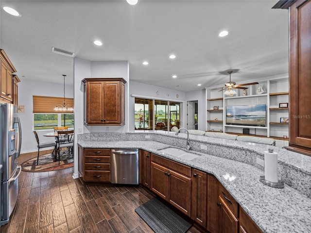 kitchen with plenty of natural light, visible vents, dark wood-type flooring, stainless steel appliances, and a sink