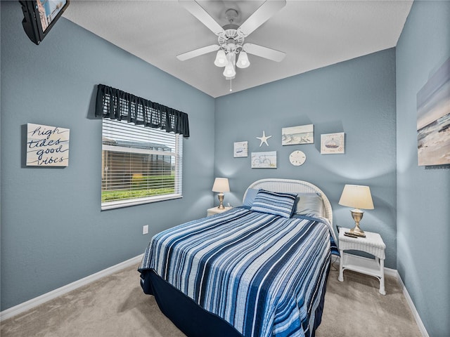 bedroom with carpet floors, ceiling fan, and baseboards