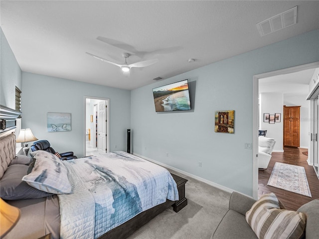 bedroom with carpet, visible vents, ceiling fan, and baseboards