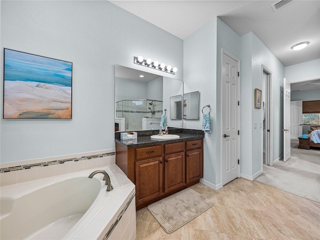 bathroom featuring a garden tub, connected bathroom, vanity, visible vents, and a shower stall