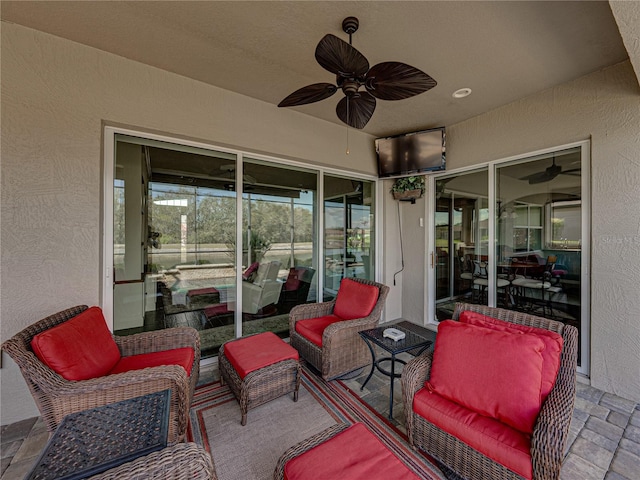 view of patio featuring an outdoor living space and a ceiling fan