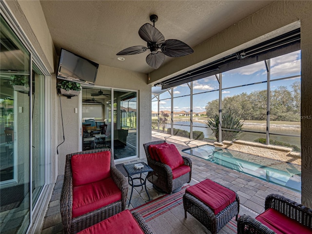 sunroom / solarium with ceiling fan