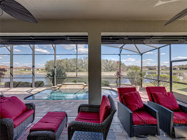 view of patio featuring an outdoor pool, glass enclosure, a water view, and an outdoor living space