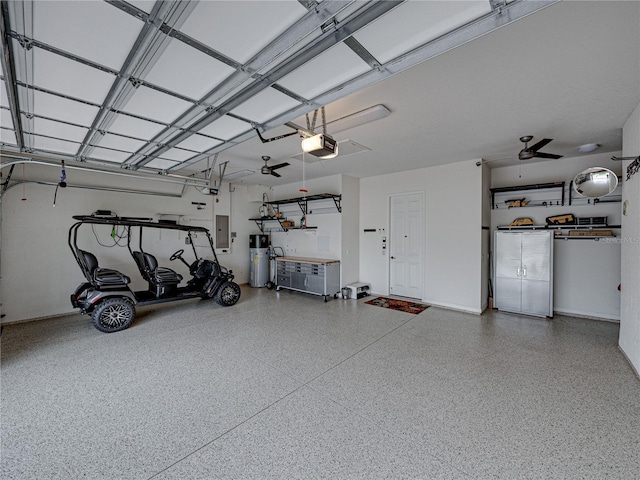 garage featuring a garage door opener, electric panel, ceiling fan, and water heater