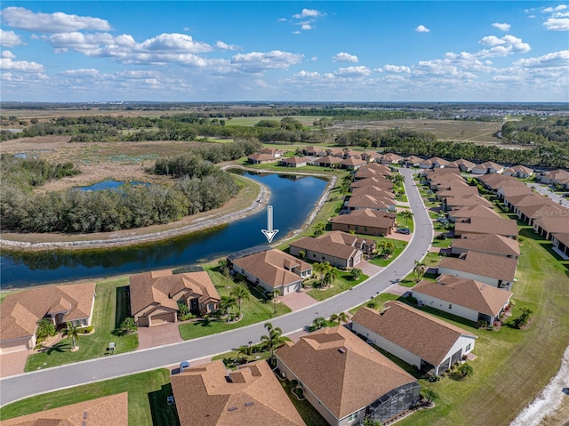 aerial view with a water view and a residential view