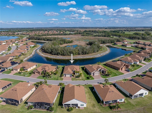 bird's eye view featuring a residential view and a water view