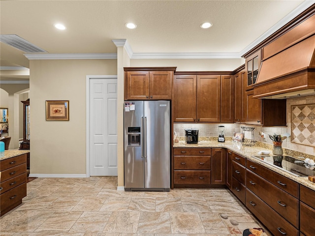 kitchen with black electric stovetop, visible vents, backsplash, light stone countertops, and stainless steel fridge with ice dispenser