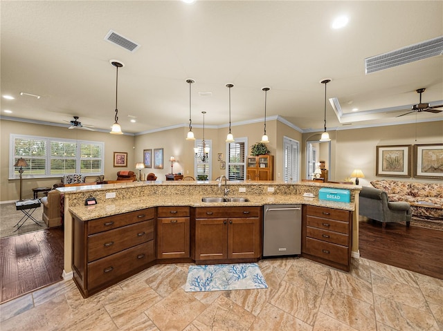 kitchen with visible vents, open floor plan, and a sink