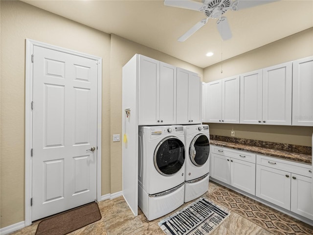 clothes washing area with washing machine and dryer, cabinet space, ceiling fan, and baseboards