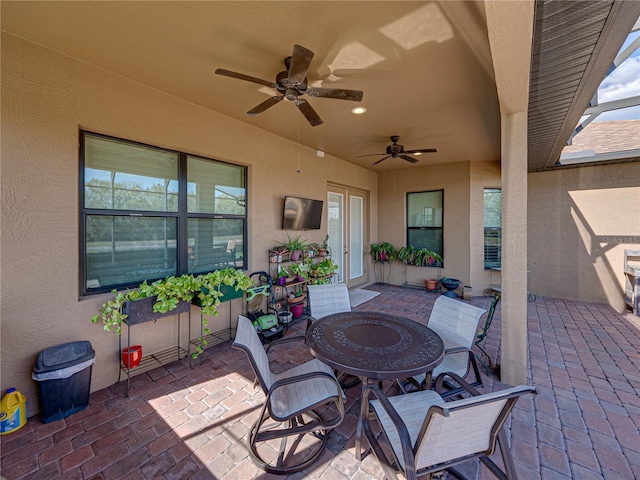 view of patio featuring ceiling fan and outdoor dining area