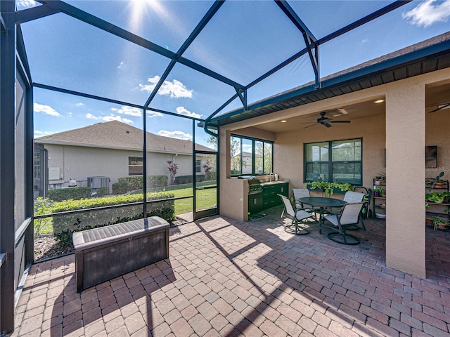 view of patio / terrace featuring glass enclosure, cooling unit, and a ceiling fan