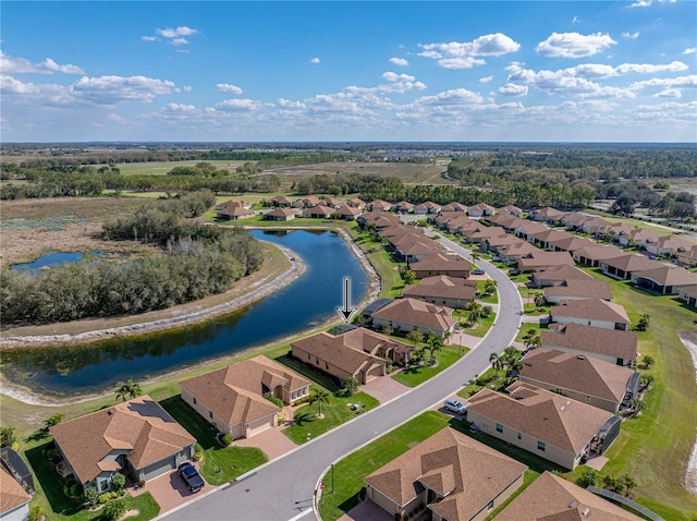 birds eye view of property with a residential view and a water view