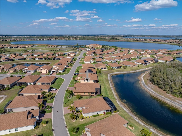 bird's eye view with a water view and a residential view