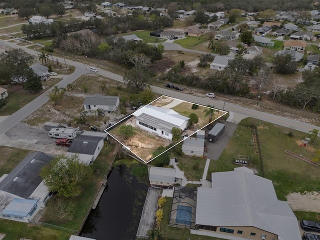 birds eye view of property with a residential view