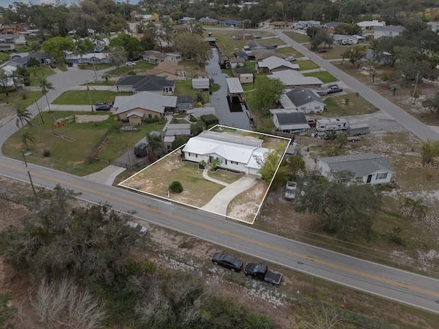 birds eye view of property with a residential view