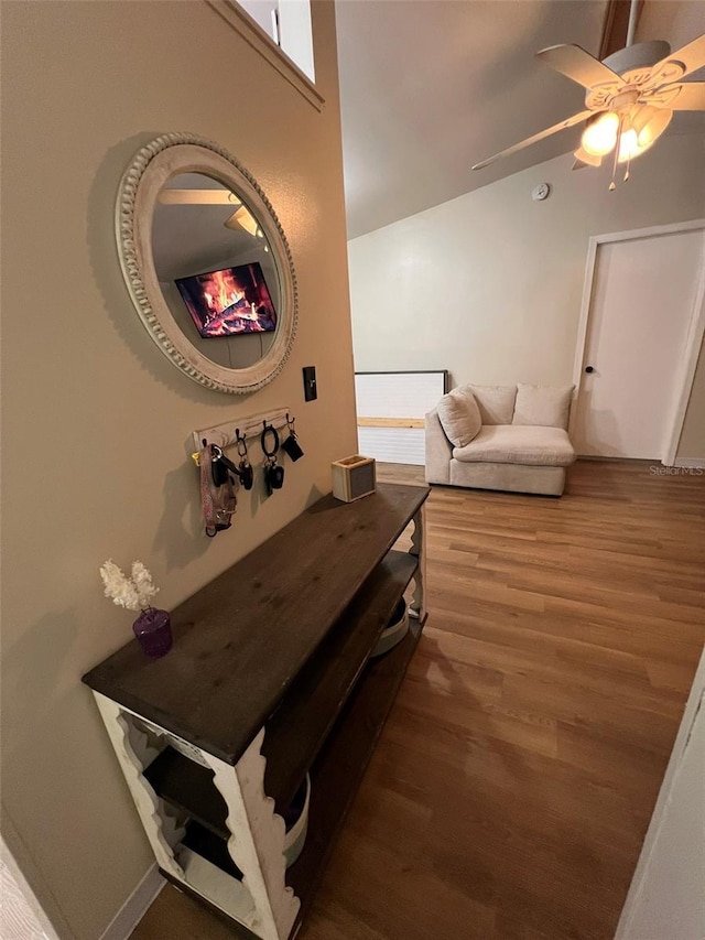 interior space featuring vaulted ceiling and wood finished floors