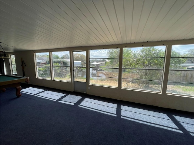 unfurnished sunroom featuring wooden ceiling and billiards