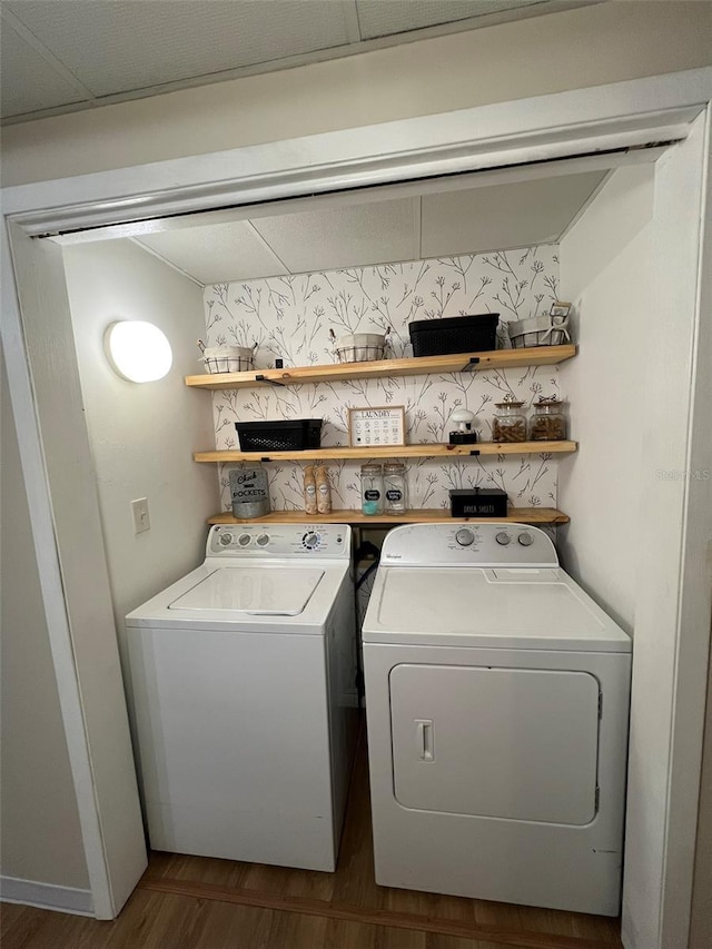 laundry area featuring laundry area, separate washer and dryer, and dark wood finished floors