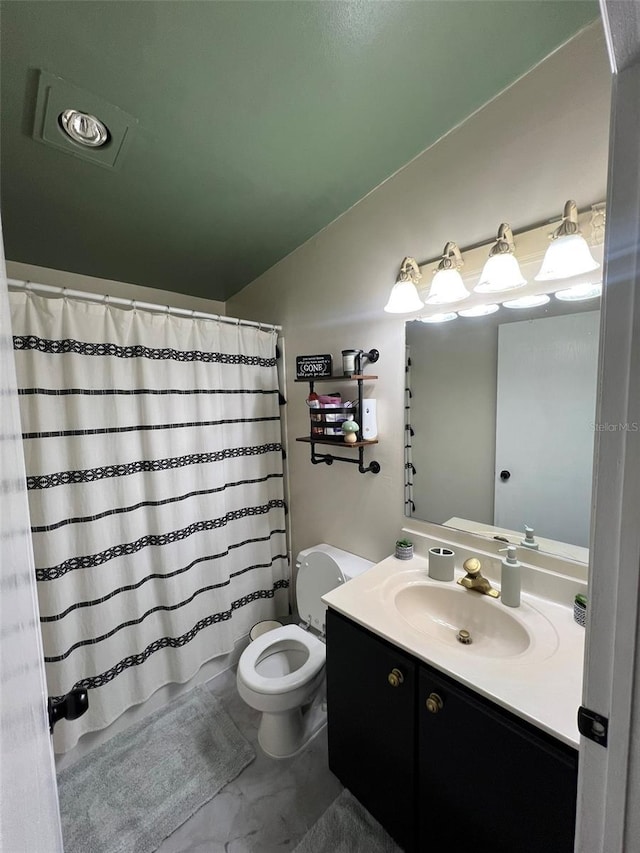 full bathroom featuring toilet, vaulted ceiling, and vanity