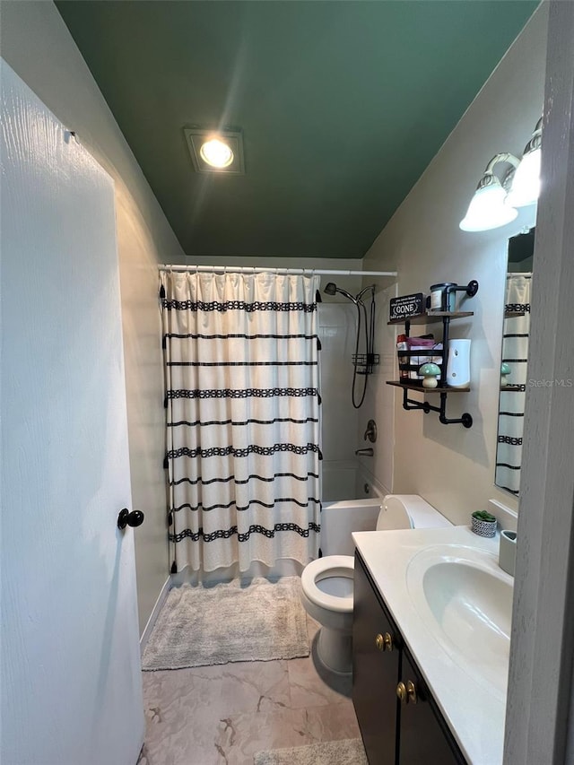 full bath featuring marble finish floor, vanity, toilet, and shower / bath combo with shower curtain