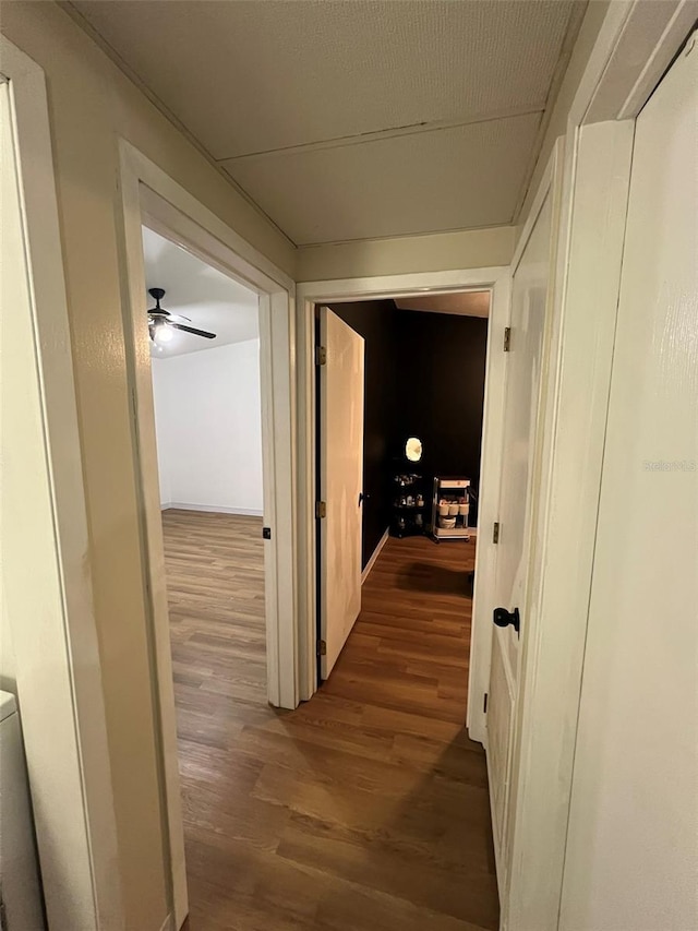 corridor with wood finished floors