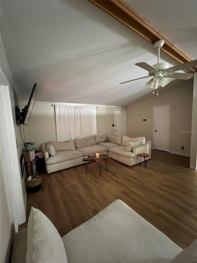 living room with lofted ceiling with beams, wood finished floors, and a ceiling fan