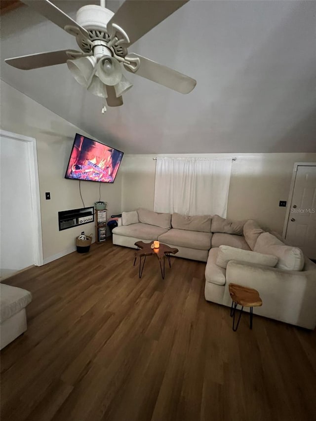 living area featuring lofted ceiling, ceiling fan, and dark wood finished floors