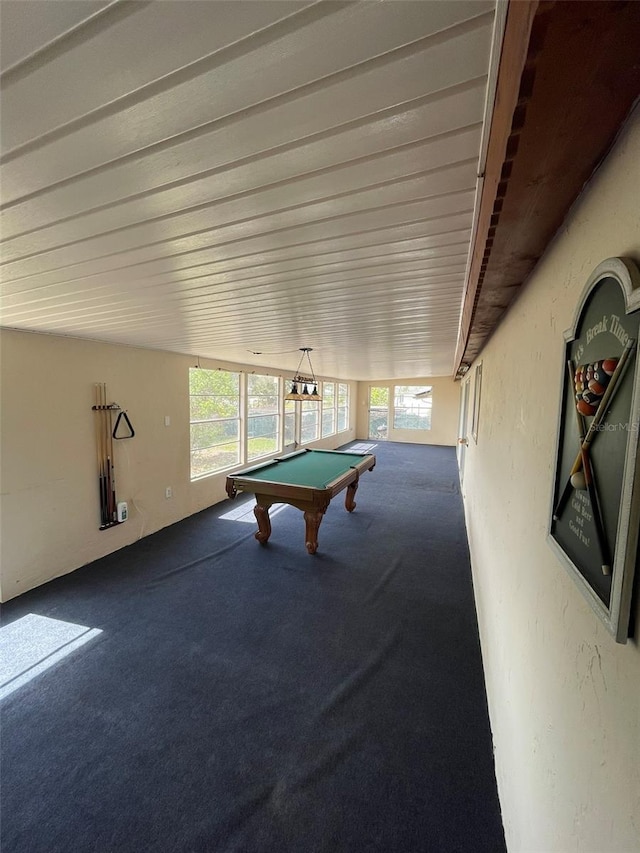 rec room with pool table, carpet, and a textured wall