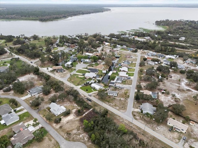 birds eye view of property with a residential view and a water view