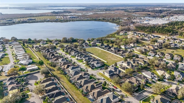 bird's eye view featuring a water view and a residential view