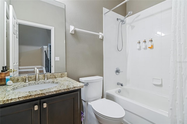 full bathroom with shower / tub combo, a textured wall, vanity, and toilet