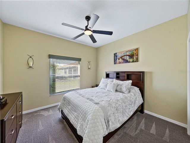 bedroom with dark carpet, baseboards, and ceiling fan