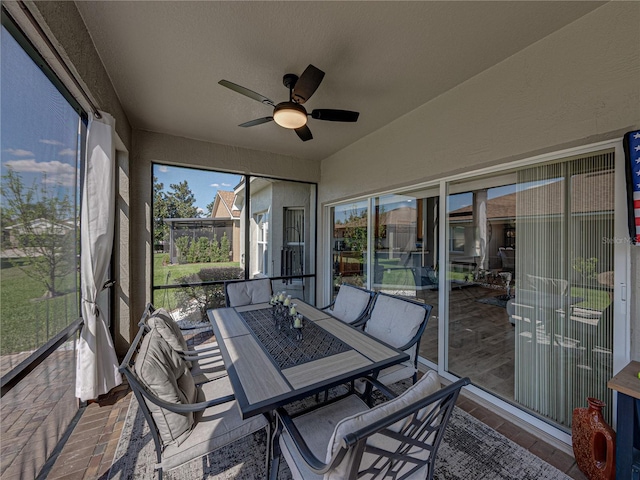 sunroom with a ceiling fan