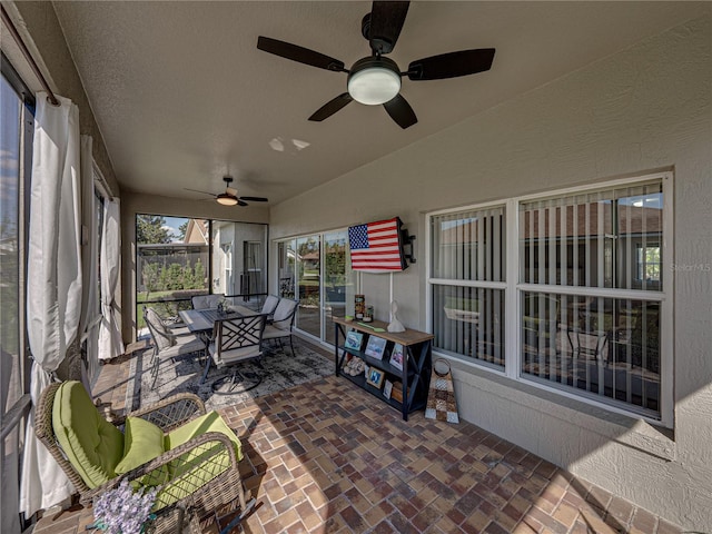 sunroom / solarium with vaulted ceiling