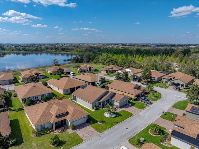 bird's eye view with a water view and a residential view