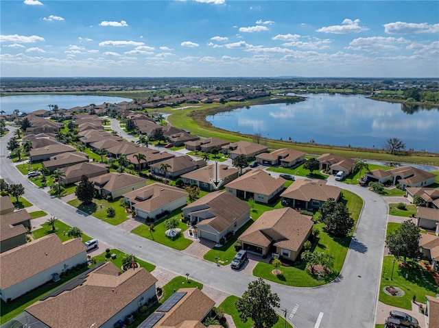 bird's eye view with a water view and a residential view