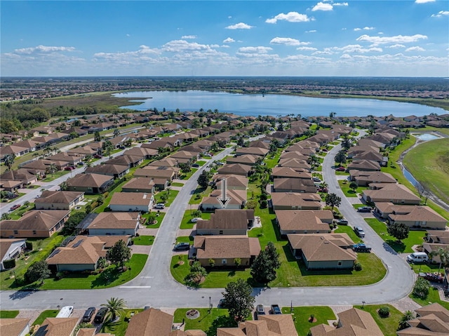 aerial view with a water view and a residential view