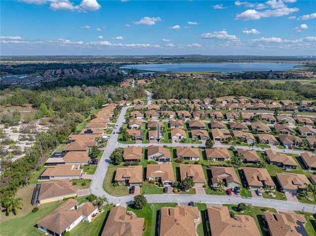 bird's eye view featuring a water view and a residential view